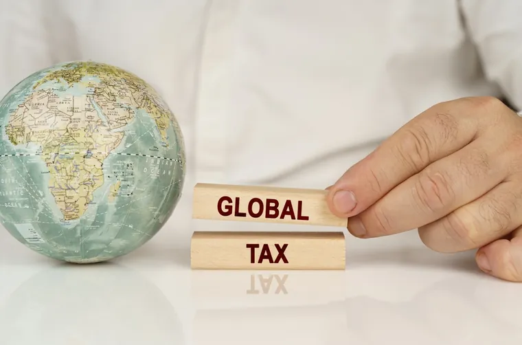 VAT and corporate tax concept image illustrating DMTT 15 Percent UAE: What Businesses Need to Know About the