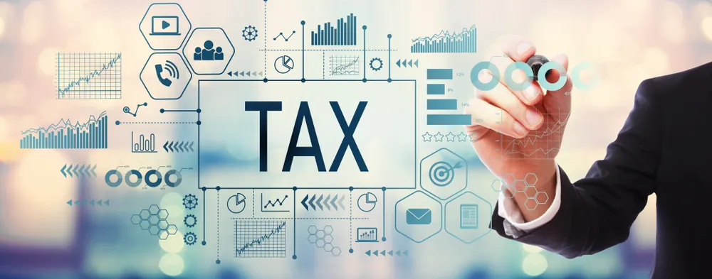 VAT and corporate tax concept image illustrating Navigating the UAE's Minimum Tax Shift: What Businesses