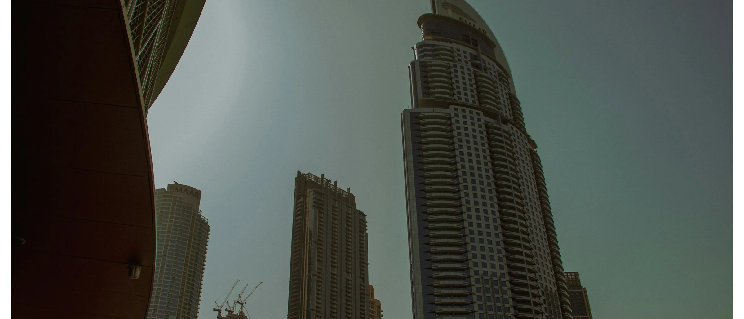 Dubai towers reaching into a hazy sky